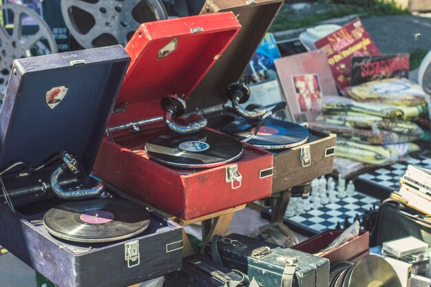 Photo different used electronics retro turntable, gramophone, phonograph records for sale on secondhand