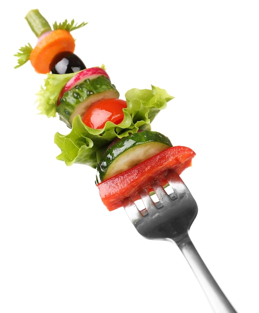 Different vegetables on fork isolated on white