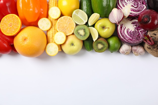 Different vegetables and fruits on white 