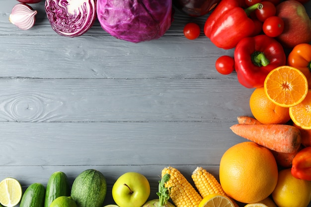 Different vegetables and fruits on wooden 