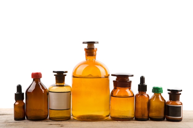 Different vintage pharmacy bottles isolated on white