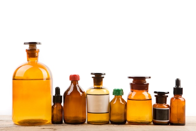 Different vintage pharmacy bottles isolated on white