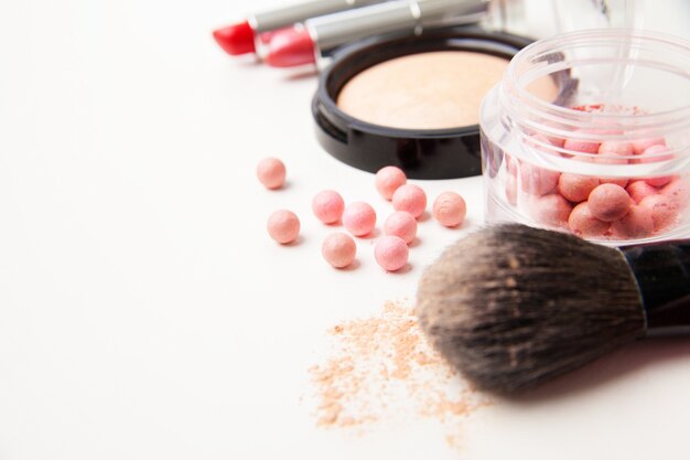 Different woman beauty cosmetics. Isolated horizontal studio shot