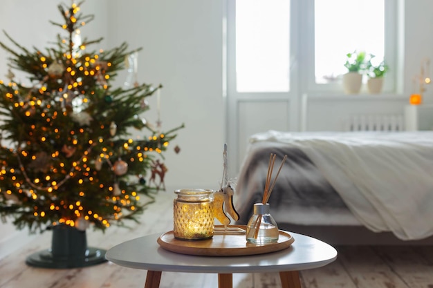 Diffuser and christmas decor in white bedroom