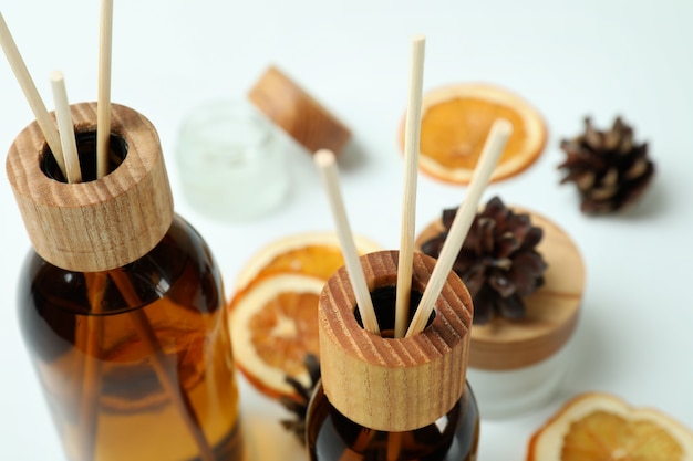 Diffusers, lemons and cones on white background