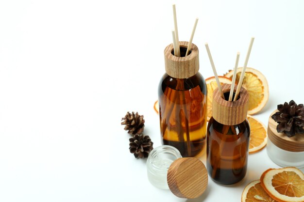 Diffusers, lemons and cones on white background