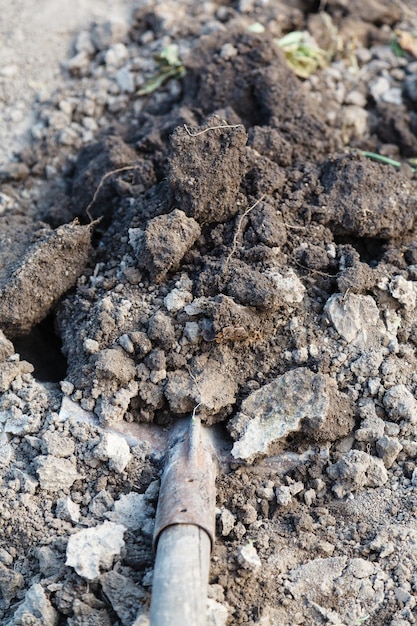 Digging a hole by spade close up