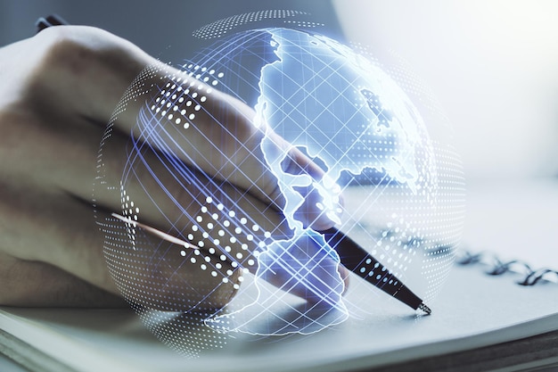 Digital America map and man hand writing in notebook on background international trading concept Multiexposure