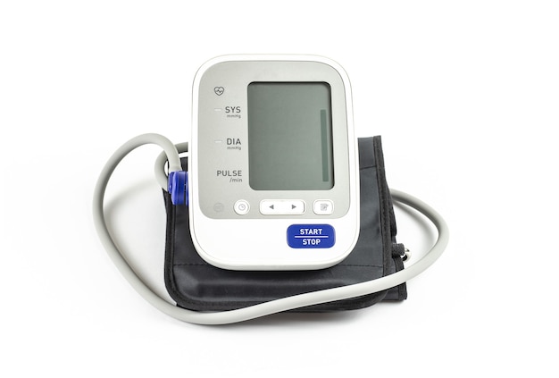 Digital automatic blood pressure monitor on a white.