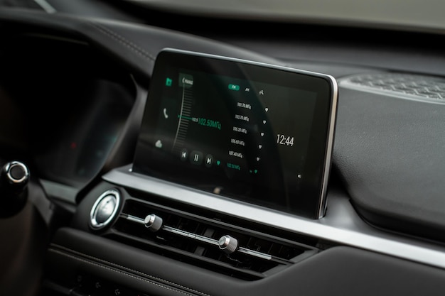 Digital car radio. modern car radio in car. smart multimedia\
touchscreen system.