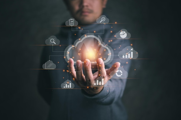 Digital composite image of businessman using interface against gray background