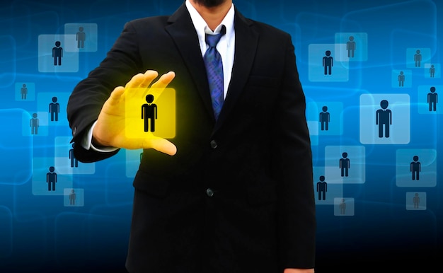 Digital composite image of businessman with symbols against blue background