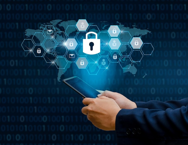 digital composite image of cropped hands using digital tablet by lock icon