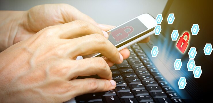 Photo digital composite image of cropped hands using phone by icons and laptop on desk