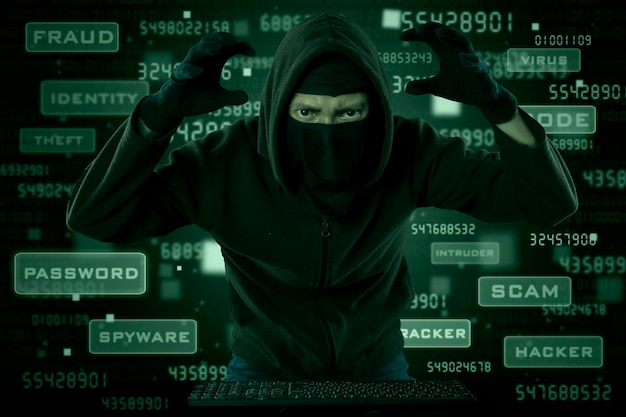 Digital composite image of hacker and text