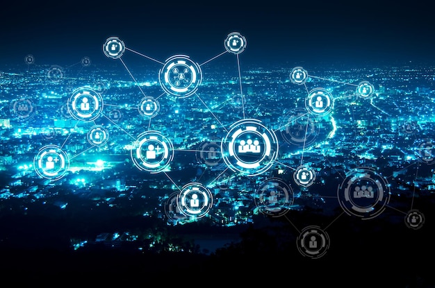 Digital composite image of icons in illuminated city at night