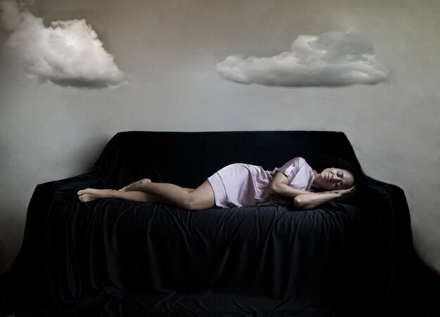 Digital composite image of man sleeping on sofa