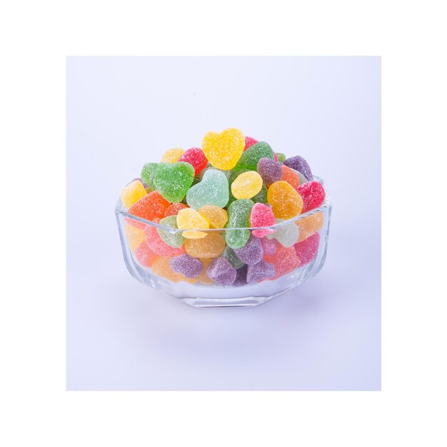 Photo digital composite image of multi colored candies against white background