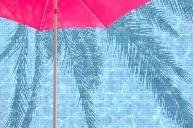 Foto immagine composita digitale di ombrello rosso e piscina con riflesso