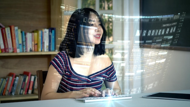 テーブルに座ってコンピューターを使っている笑顔の若い女性のデジタル複合画像