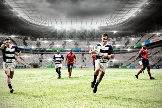 Digital composite image of team of rugby players playing rugby in sports stadium