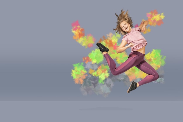 Photo digital composite image of woman jumping against gray background