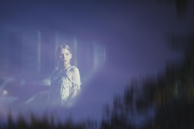 Digital composite image of woman standing outdoors