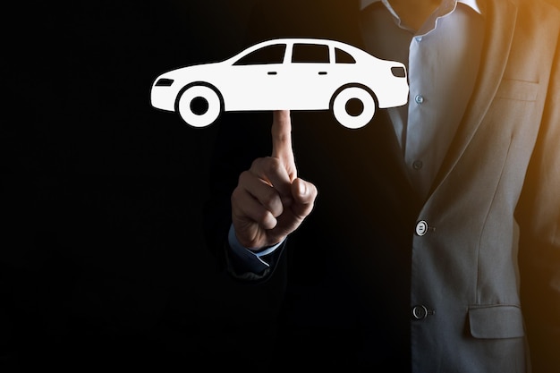 Digital composite of Man holding car icon.Car automobile insurance and car services concept. Businessman with offering gesture and icon of car