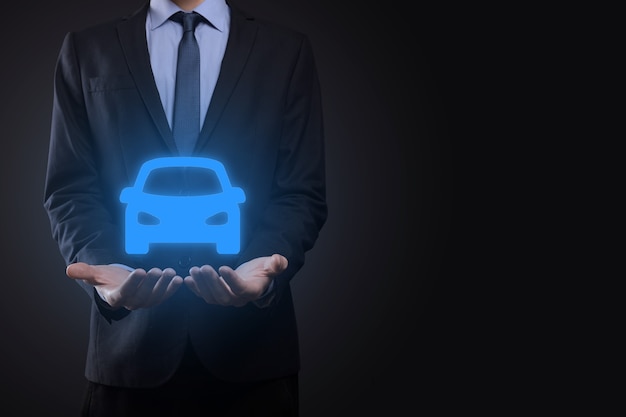 Photo digital composite of man holding car icon.car automobile insurance and car services concept. businessman with offering gesture and icon of car.