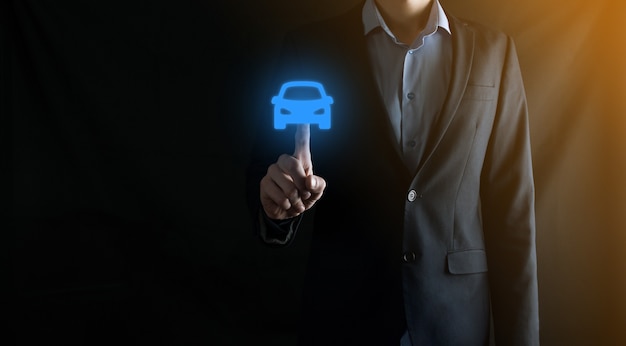 Digital composite of Man holding car icon.Car automobile insurance and car services concept. Businessman with offering gesture and icon of car.