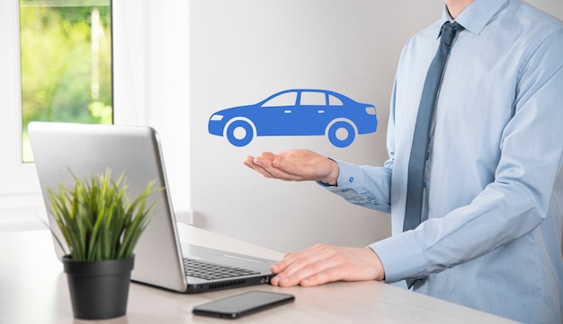 Digital composite of Man holding car icon.Car automobile insurance and car services concept. Businessman with offering gesture and icon of car.