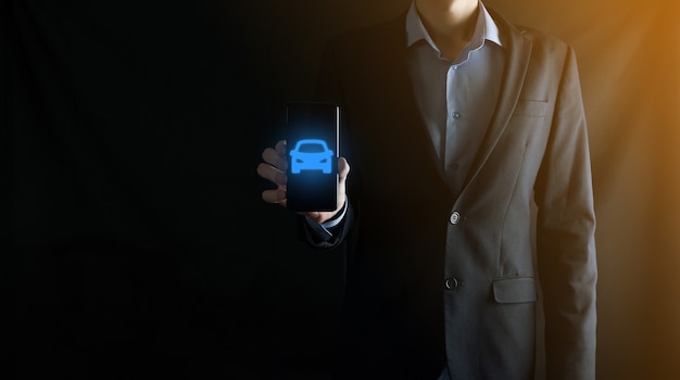 Digital composite of Man holding car icon