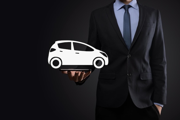 Digital composite of Man holding car iconCar automobile insurance and car services concept Businessman with offering gesture and icon of car