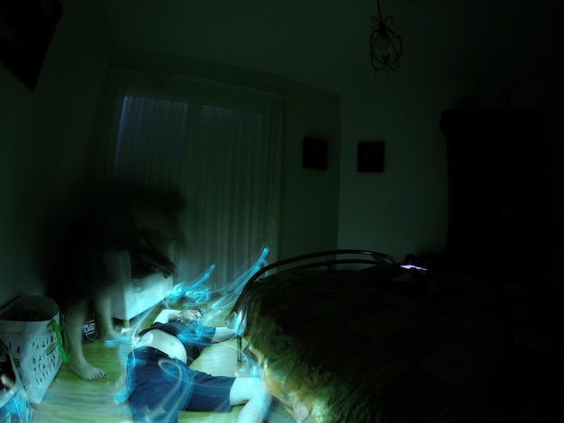 digital composite of woman performing magic on man in bedroom