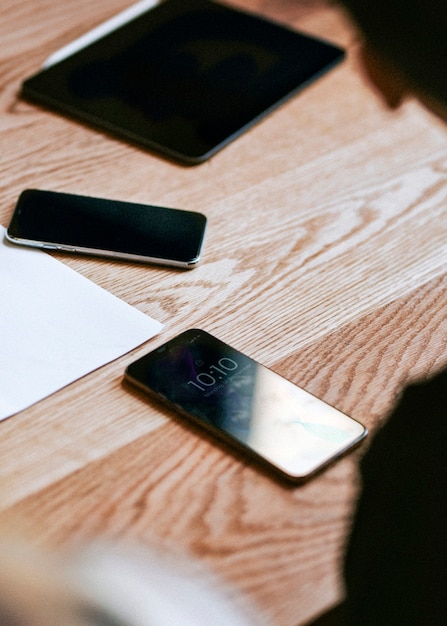 Digital devices on a wooden table