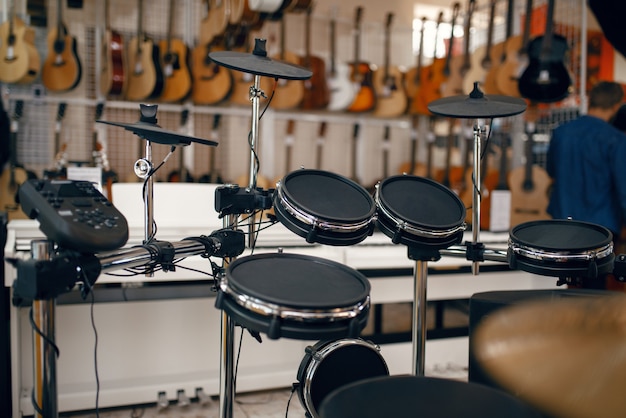 Photo digital drum set on showcase in music store, closeup view, nobody. assortment in musical instrument shop, professional equipment for musicians and performers