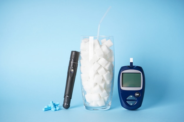 Digital glucometer, sugar in a glass