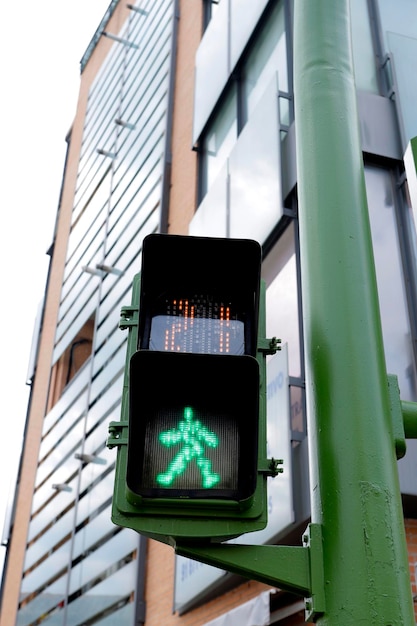 Digital green pedestrian traffic light