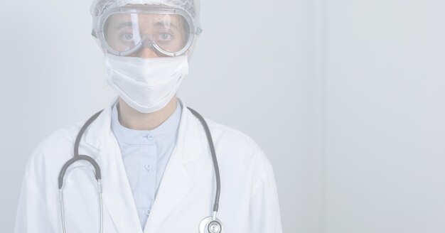 Digital illustration of a doctor wearing a face mask and
protective gloves, looking at the camera with a white background.
medicine public health pandemic coronavirus covid 19 outbreak
concept digital