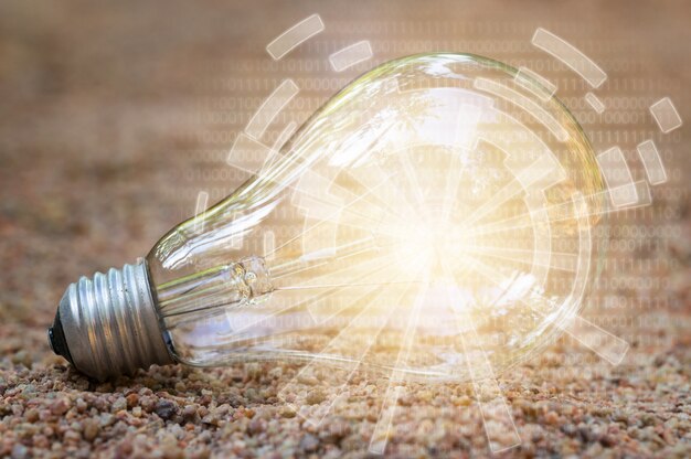 Digital light bulb / illuminated in the sand