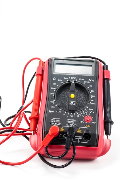 Photo digital multimeter  on the white surface