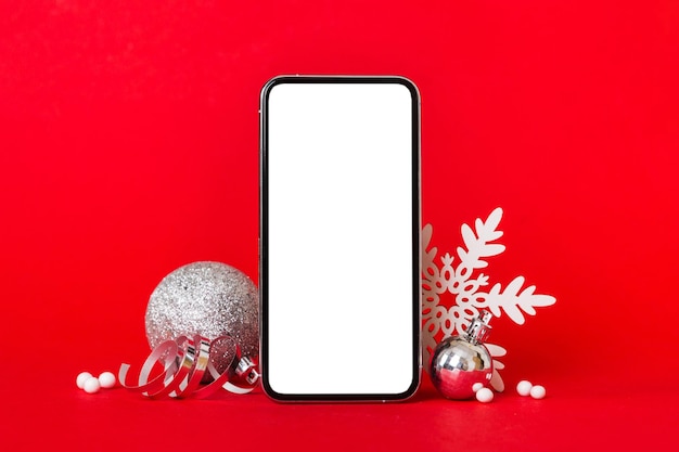 Digital phone mock up with rustic christmas decorations for app\
presentation with empty space for you design christmas online\
shopping concept tablet with copy space on colored background