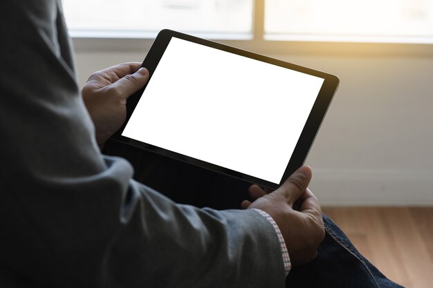 Digital tablet computer close up man using tablet hands man multitasking 