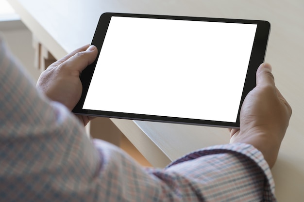 Digital tablet computer close up man using tablet hands man multitasking 