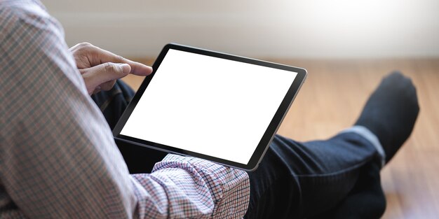 Digital tablet computer close up man using tablet hands man multitasking 