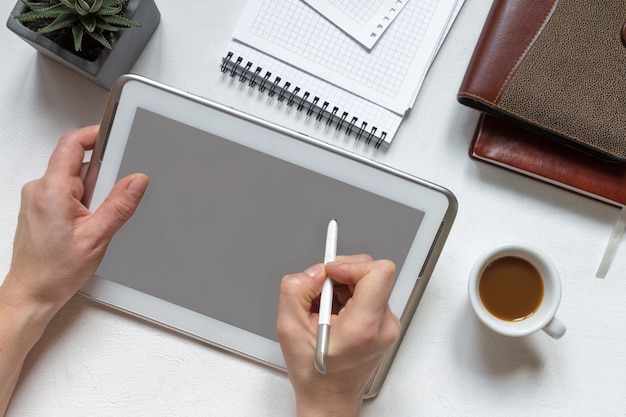 Digital tablet computer with isolated screen in female hands