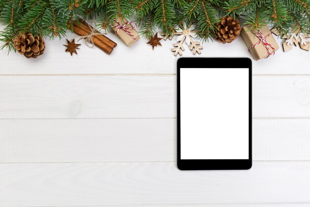 Digital tablet mock up with rustic Christmas background