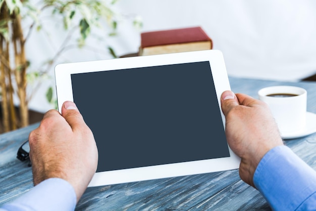 Digital tablet with blank screen in coffee shop cafe