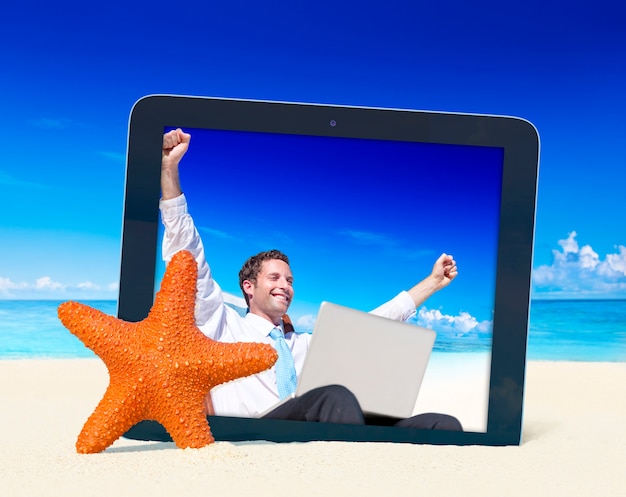 Digital tablet with photo of a man on the beach