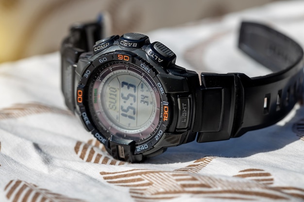 A digital watch with a solar panel for hiking in the mountains